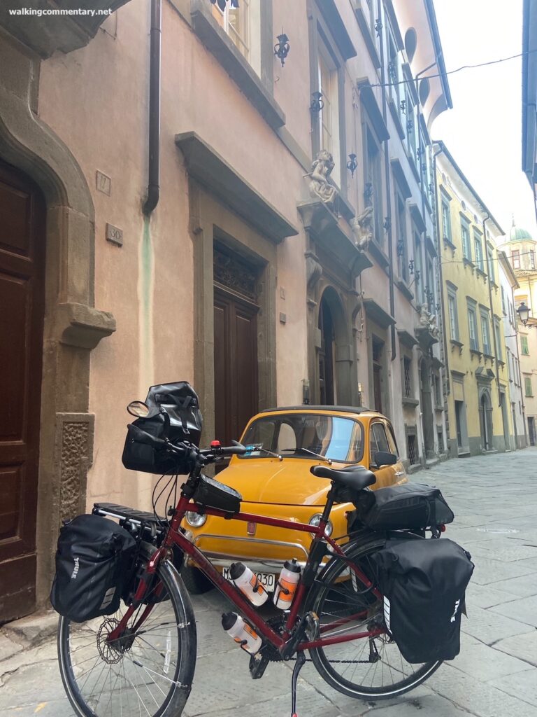 bike with Fiat 500 in street